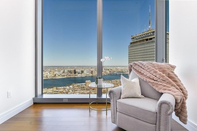 1 Dalton St Unit 5102, Boston, MA 02115 - sitting room with wood finished floors and a water view