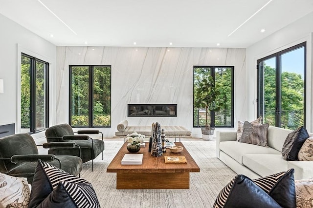 living room featuring recessed lighting and a fireplace