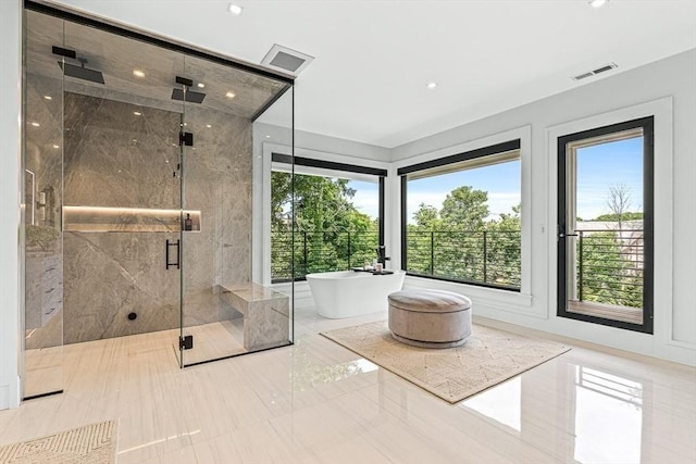 bathroom featuring a soaking tub, a marble finish shower, visible vents, and marble finish floor