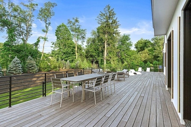 wooden terrace with outdoor dining area