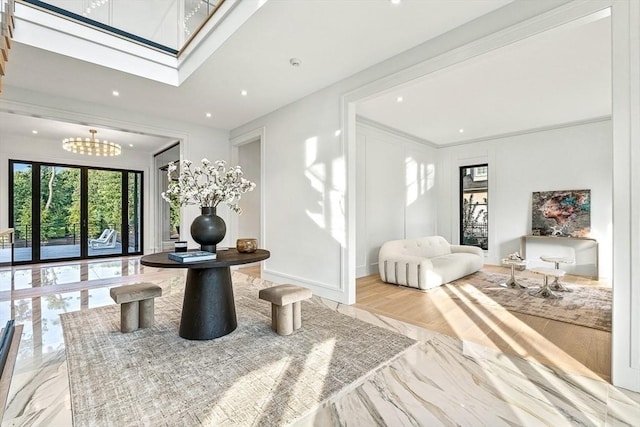 interior space featuring a skylight, marble finish floor, baseboards, and recessed lighting