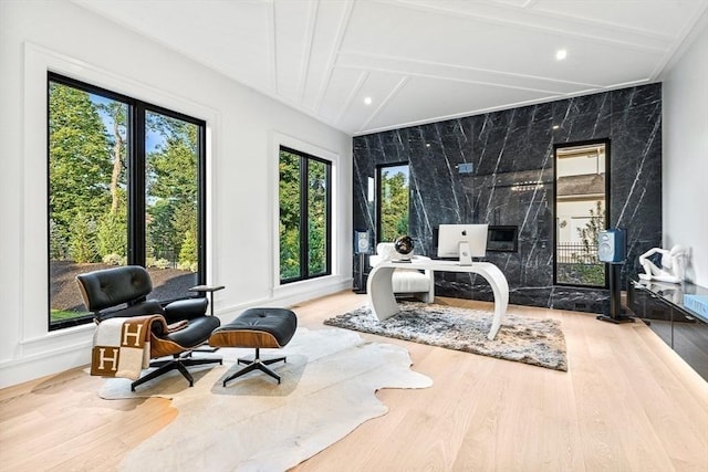 sitting room featuring vaulted ceiling with beams, wood finished floors, and recessed lighting