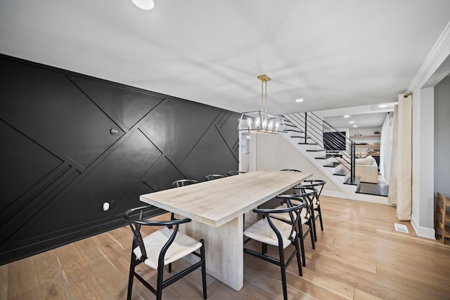 dining space featuring light wood-type flooring