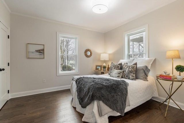 bedroom featuring dark wood-style floors, multiple windows, and baseboards