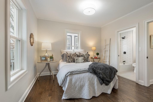 bedroom with dark wood-style floors, baseboards, ensuite bathroom, and ornamental molding