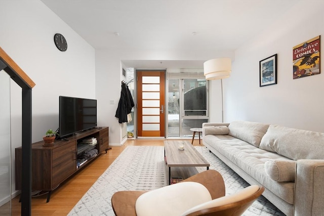 living room with light hardwood / wood-style floors