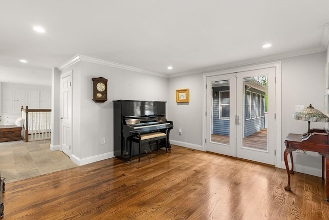 56 Arrowhead Rd, Weston, MA 02493 - living area with french doors, baseboards, recessed lighting, ornamental molding, and wood finished floors