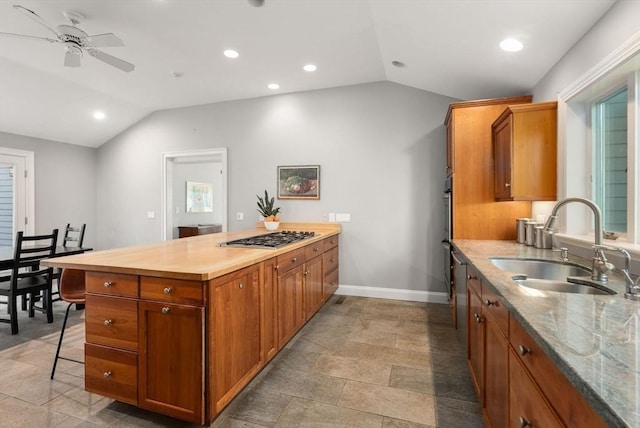 56 Arrowhead Rd, Weston, MA 02493 - kitchen with lofted ceiling, a sink, ceiling fan, brown cabinets, and baseboards