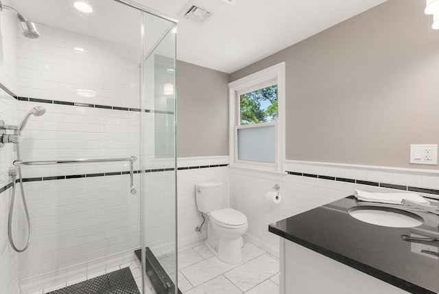 56 Arrowhead Rd, Weston, MA 02493 - bathroom featuring toilet, a shower stall, tile walls, wainscoting, and vanity