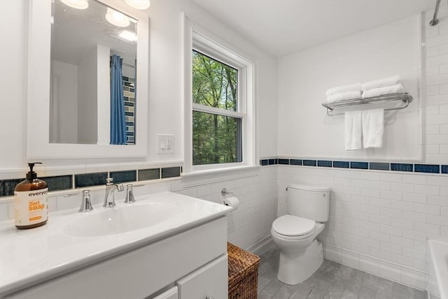 56 Arrowhead Rd, Weston, MA 02493 - full bath featuring tile walls, toilet, vanity, wainscoting, and a bathtub
