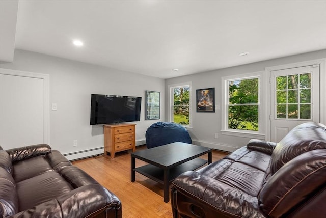 56 Arrowhead Rd, Weston, MA 02493 - living room featuring a baseboard heating unit, light wood finished floors, recessed lighting, and baseboards