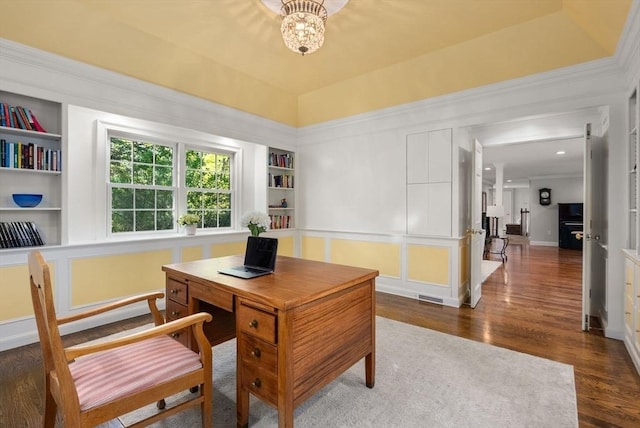 56 Arrowhead Rd, Weston, MA 02493 - office area with built in shelves, a chandelier, wood finished floors, and baseboards