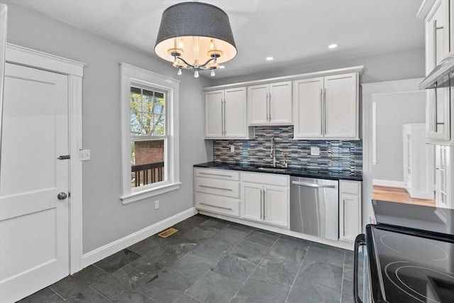 kitchen featuring white cabinets, dark countertops, a sink, dishwasher, and black electric range