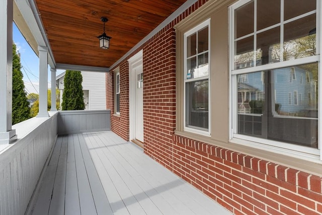 wooden terrace with a porch