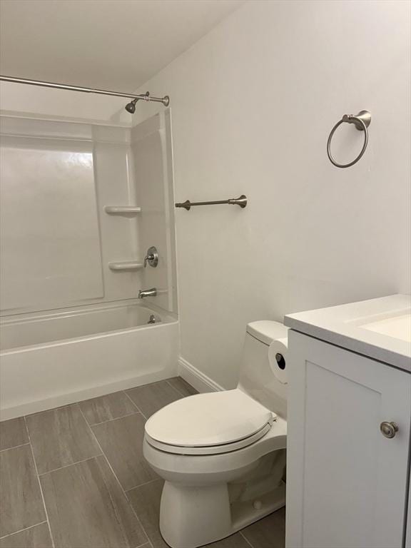 1550 Worcester Rd Unit 503, Framingham, MA 01701 - full bathroom with toilet, vanity, tub / shower combination, and baseboards
