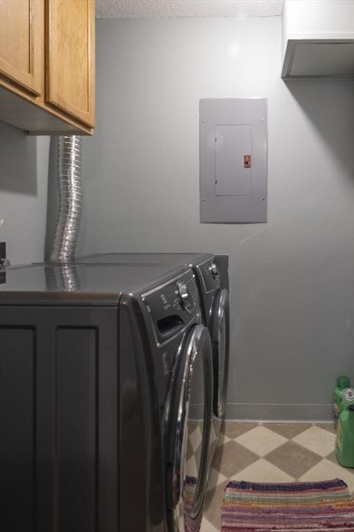 140 Heritage Dr Unit 140, Northbridge, MA 01588 - laundry room featuring electric panel, washer and clothes dryer, cabinet space, and light floors
