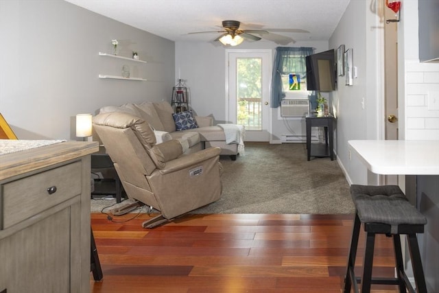 140 Heritage Dr Unit 140, Northbridge, MA 01588 - living area with ceiling fan, cooling unit, dark wood-type flooring, and a baseboard heating unit
