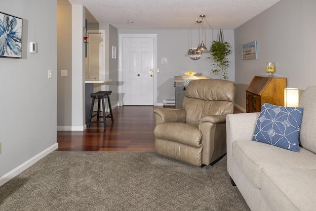 140 Heritage Dr Unit 140, Northbridge, MA 01588 - carpeted living area featuring baseboard heating and a textured ceiling