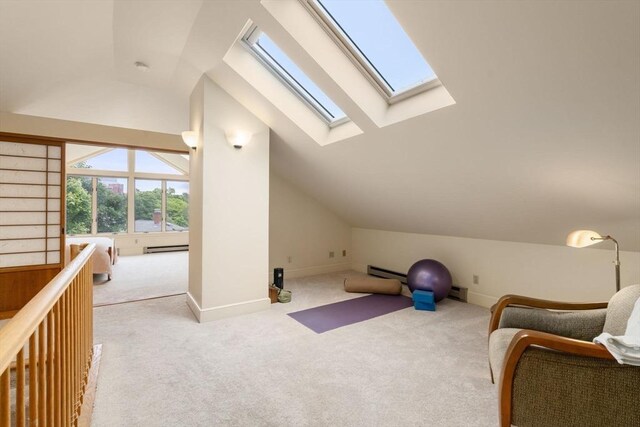 50-52 Linden Pl, Brookline, MA 02446 - living area featuring a skylight, lofted ceiling, carpet flooring, baseboard heating, and a baseboard radiator