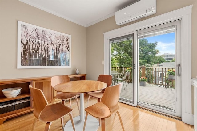 50-52 Linden Pl, Brookline, MA 02446 - dining area featuring a wall mounted AC, light wood-type flooring, and crown molding