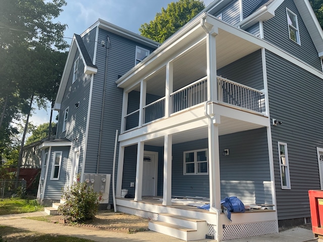 exterior space with a balcony and a porch