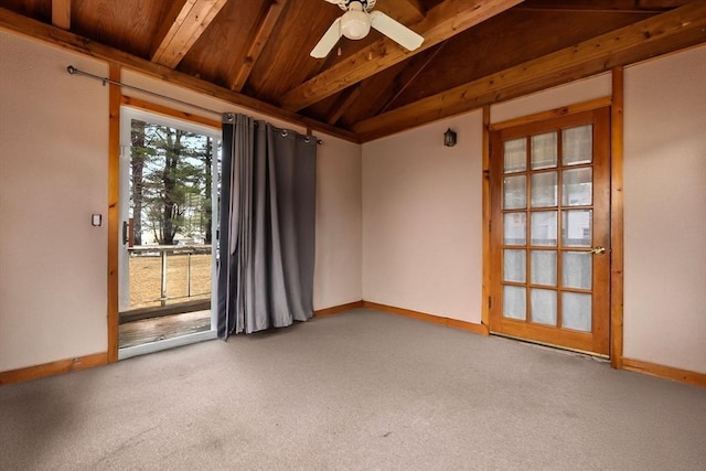 empty room with carpet, vaulted ceiling with beams, a ceiling fan, and baseboards