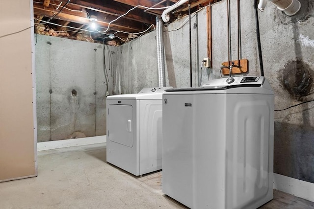 clothes washing area featuring laundry area and independent washer and dryer