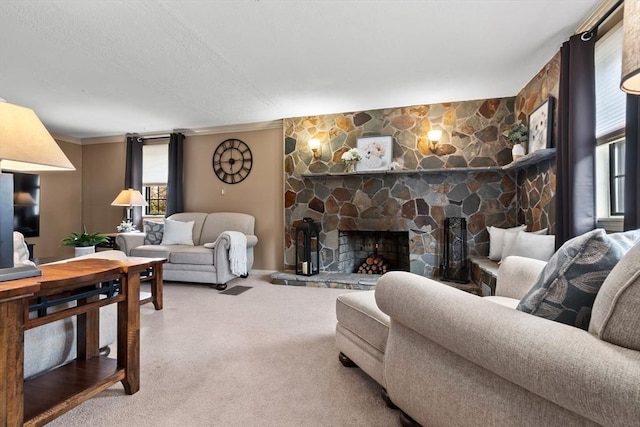 carpeted living room with a healthy amount of sunlight, a fireplace, and crown molding