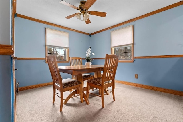 dining space featuring baseboards, carpet, and ornamental molding