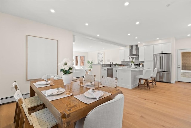 354 Gifford Unit 1, Falmouth, MA 02540 - dining area featuring light wood-type flooring, recessed lighting, and a baseboard radiator