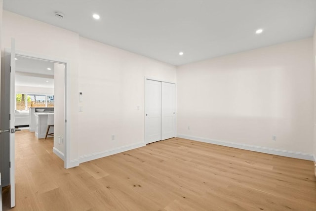 354 Gifford Unit 1, Falmouth, MA 02540 - unfurnished bedroom featuring light wood-style floors, baseboards, and recessed lighting