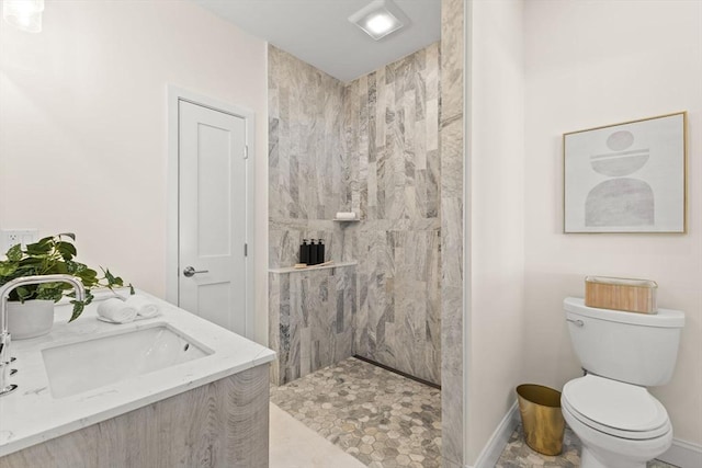 354 Gifford Unit 1, Falmouth, MA 02540 - full bathroom with tiled shower, toilet, vanity, and baseboards