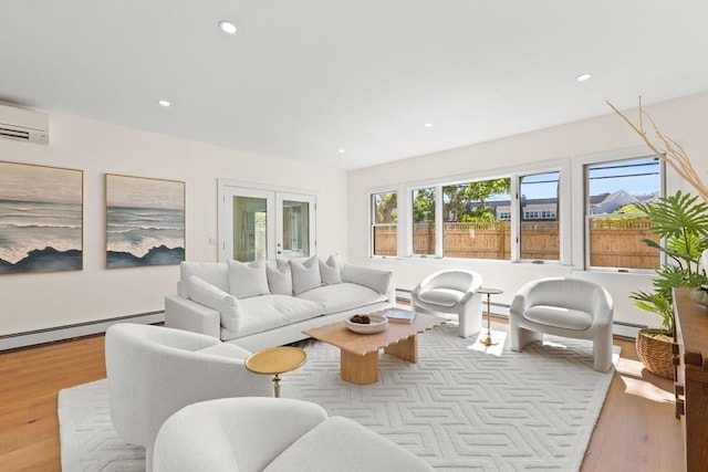 354 Gifford Unit 1, Falmouth, MA 02540 - living area with a baseboard radiator, a wall unit AC, wood finished floors, plenty of natural light, and recessed lighting