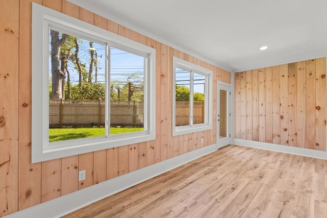 354 Gifford Unit 1, Falmouth, MA 02540 - unfurnished room with wood walls, wood finished floors, healthy amount of natural light, and baseboards