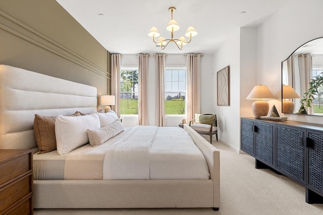 bedroom featuring baseboards, a notable chandelier, and carpet flooring