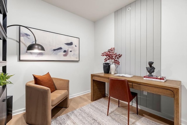 office space with wood finished floors and baseboards