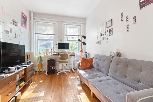living area featuring a desk and light wood-type flooring