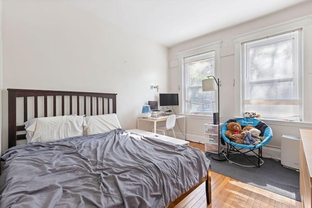bedroom with wood finished floors