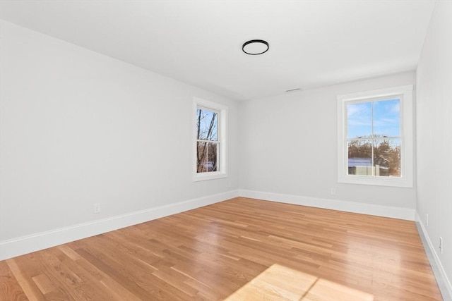 spare room featuring light hardwood / wood-style floors