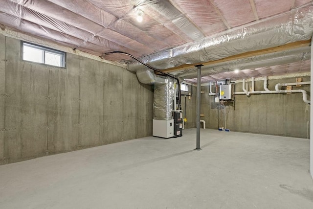 basement with tankless water heater and heating unit