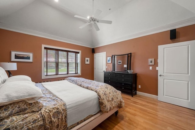 bedroom with ceiling fan, crown molding, baseboards, high vaulted ceiling, and light wood-style flooring
