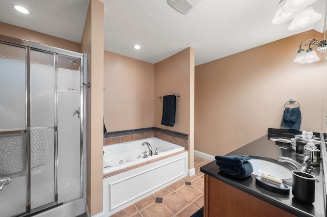 full bathroom featuring vanity, a whirlpool tub, a shower stall, and tile patterned floors