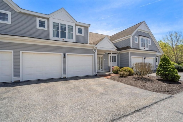 view of front of home with an attached garage and driveway