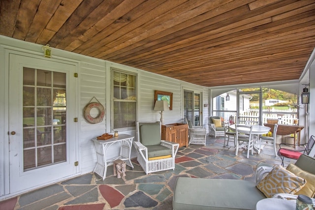 sunroom featuring wood ceiling