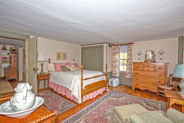 bedroom featuring a closet and hardwood / wood-style flooring