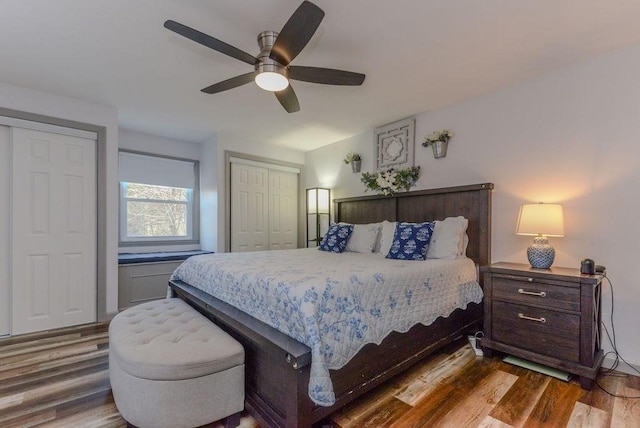 bedroom with ceiling fan and dark hardwood / wood-style flooring