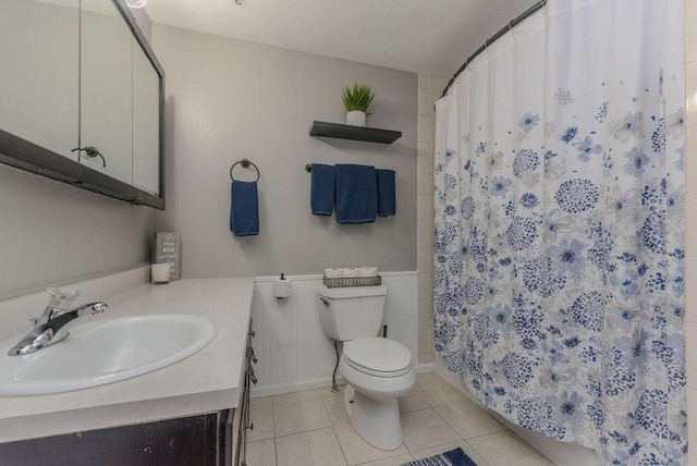 bathroom with tile patterned flooring, vanity, toilet, and a shower with shower curtain