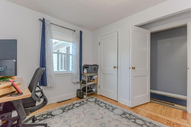 office area featuring hardwood / wood-style floors