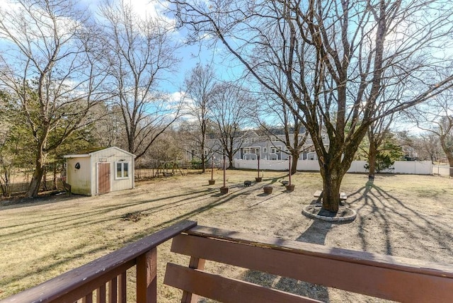 view of yard with a storage unit