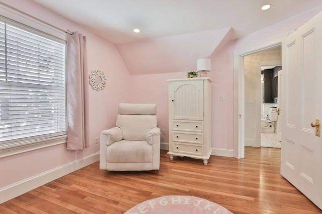 sitting room featuring light wood-type flooring, lofted ceiling, baseboards, and recessed lighting